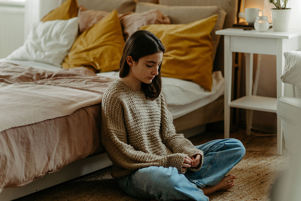 young girl struggling with poor mental health